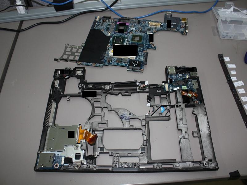 Remove 8 screws from the motherboard using the #0 Philips Screwdriver. 4 black screws are found along the edges of the motherboard.