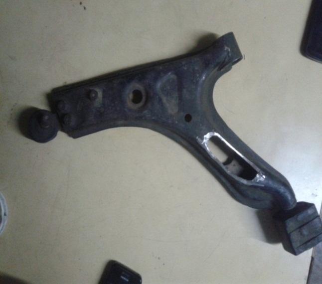 The lower control arm is hinged on the supports as shown below. 2.