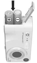 2. Install the Batteries 1. Open the Battery/Memory card door on the side of the camera by sliding the door toward the bottom of the camera. 2. Insert the batteries as indicated inside the door. 3.