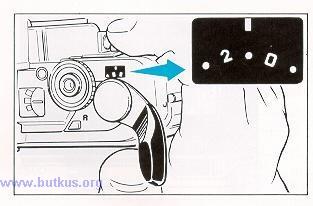 6) While watching the Exposure Counter, wind the film with the Film Advance Lever and press down the Shutter Release.