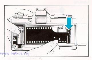 3) Pull out the film tip and insert it deeply into the slot of the Take-up