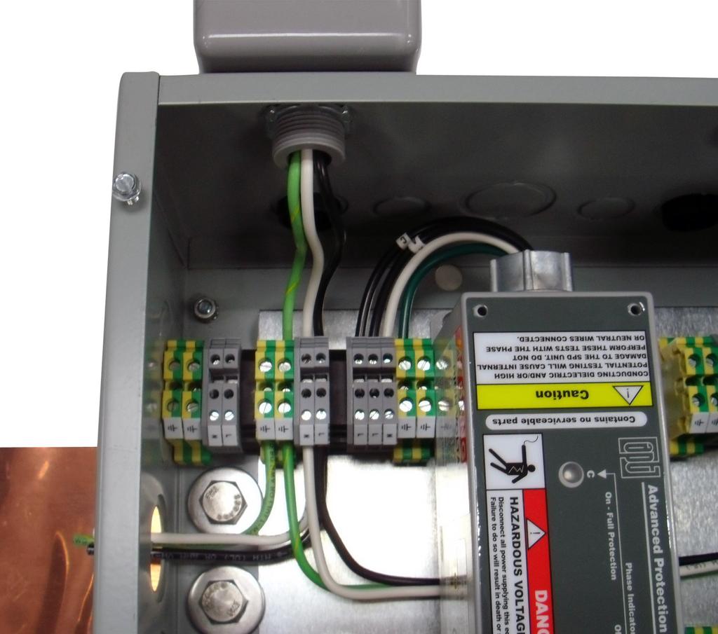 Notice orientation of LED indicator. Rotate SPD such that LED is visible from front. Connect SPD AC-Hot or DC-Positive to terminal block as shown in Figure 6.