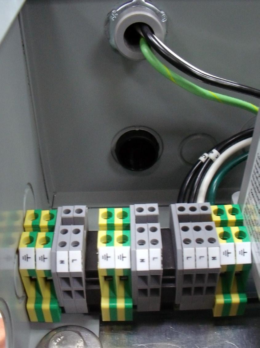 The load goes in and out of the terminal. The SPD is connected electrically in parallel, not in series. Connect SPD Ground to terminal block as shown in Figure 6.