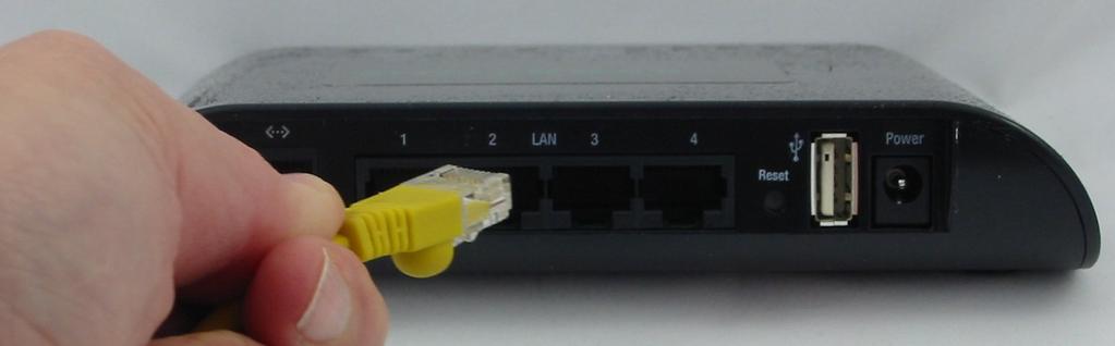 ) Connect an Ethernet cable to the computer and one of the LAN ports
