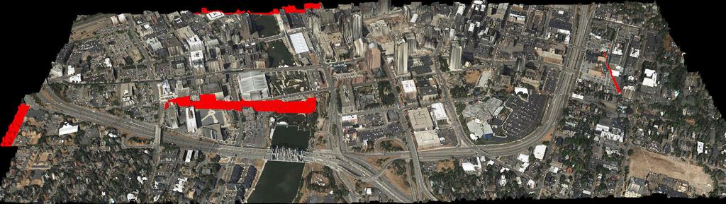 Figure 5. A registered 3D LiDAR mesh model of Rochester, NY [8]. Red color indicates no image information available in that area.