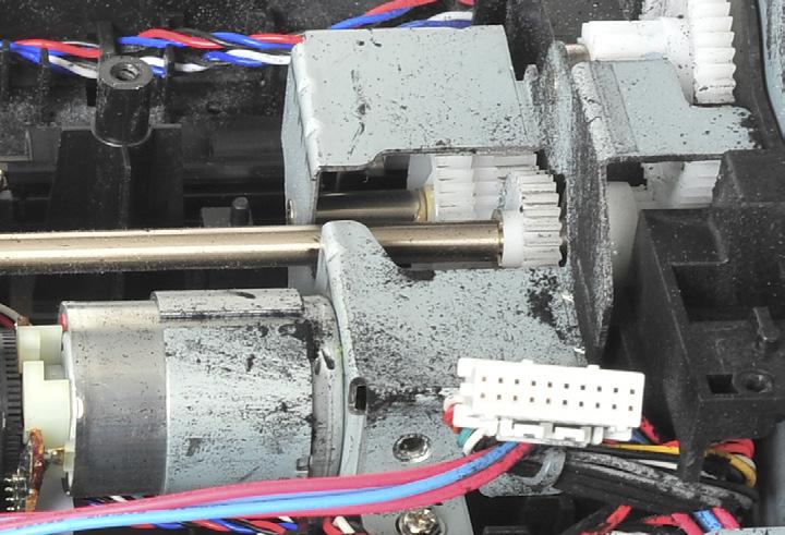 The printer using Brand #1 cartridges shows moderate toner leakage within the mechanical/electrical system.