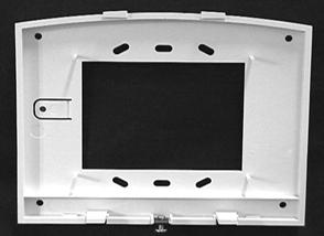 2. For wall mounting, place the mounting plate on the wall and mark the mounting holes (see Figure 2). Be sure to leave a 3-inch clearance below for the touchpad door to open. Figure 2. Mounting hole locations Mounting Holes Mounting Holes 3.