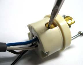 Insert the Brown wire / Black dotted strip wire combination back into the sensor plug and screw the retaining screw back