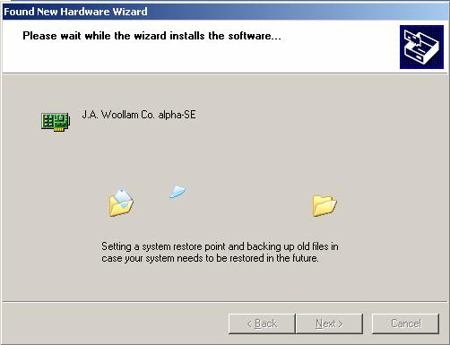 Figure 2-15. Dialog boxes displayed by Windows XP during installation of alpha-se drivers.