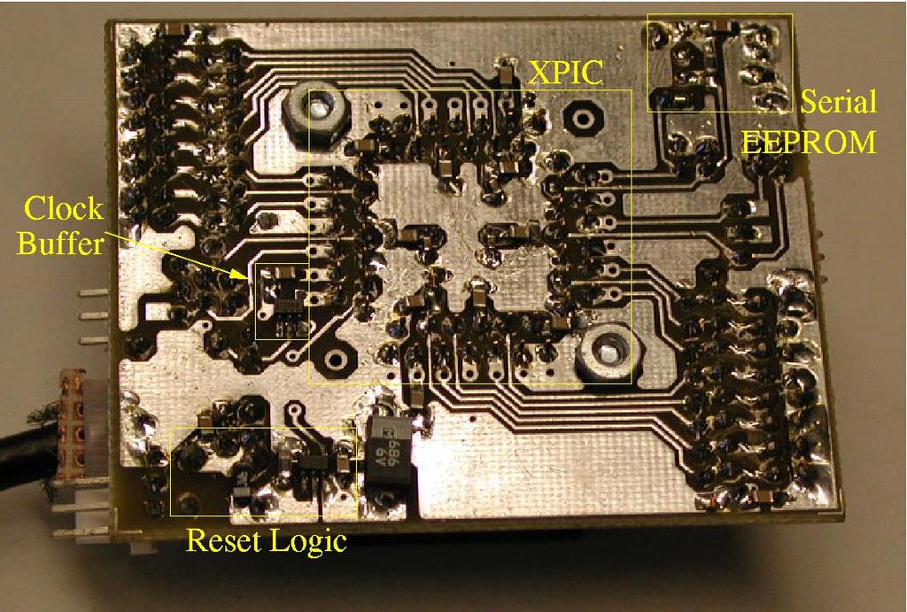 Figure 8: Bottom of the XPIC test board. 3.2.3 Reset The reset circuit consists of a pushbutton, a resistor, a capacitor, and a Schmitt Trigger inverter. It will generate a 0.
