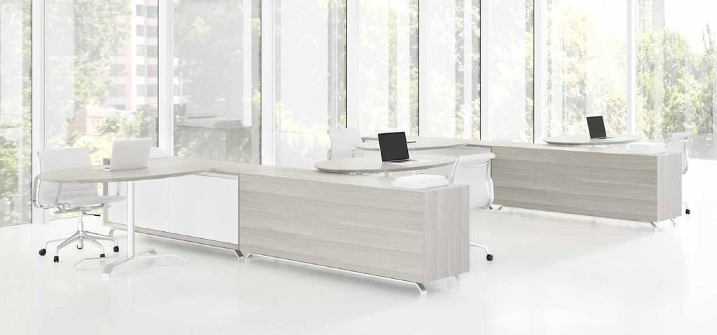 future proof In an open environment, sleek tables and storage components float above the floor on spring-like metal supports,