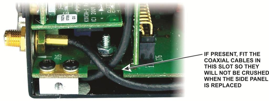 hole (Figure 10, pg 6). Be sure the cable is routed through the notch in the circuit board as shown to avoid it being crushed by the side panel (Figure 21). Figure 21.