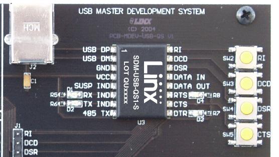The RS-232 area connects the QS module to a standard DB9 serial connector through a RS-232 level converter chip.
