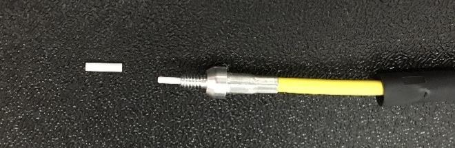 Remove the Ferrule Adapter by holding the crimp sleeve and unthreading from the Ferrule Adapter Assembly to expose the white