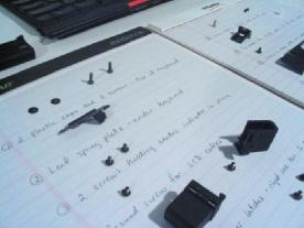 Figure 11-58 Using a notepad can help you organize screws so you know which screw