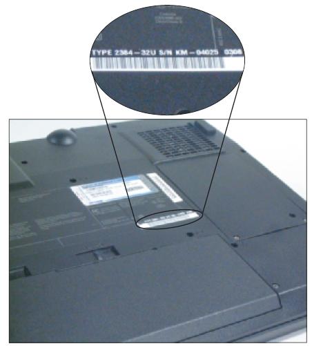Figure 11-2 The model and serial number stamped on the bottom of a notebook are used to identify the