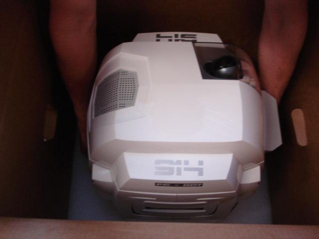 STEP 3 - Un-packing the robot cont. Reach into the box and grab the handles on the PC-BOT.