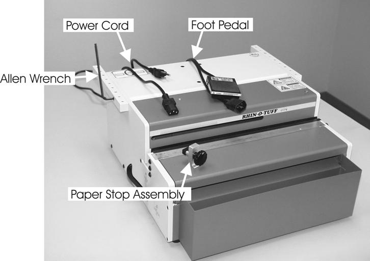 (UL machines only). Fig. A Raise the lid on your HD punch and remove the Paper Stop Assembly by grasping the nut just under the cover and turning the knob until the assembly clears the machine.
