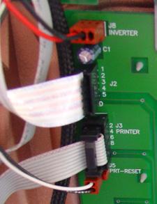 Disconnect the low paper sensor cable at connector J11 on the printer control board.