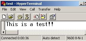 Application Test Run: Execution of the function block is started by switching on input bit IB00001. The HyperTerminal window shows the text output.