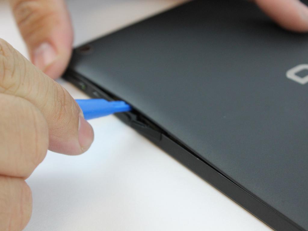 Step 1 Back Panel Starting at the Micro SD Card Slot and using the blue plastic