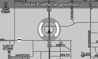 Scroll the map to position the arrowhead at your correct position. Press u. 4. Rotate i to position the arrowhead in the correct direction the vehicle is facing. 5. Press u to select OK.