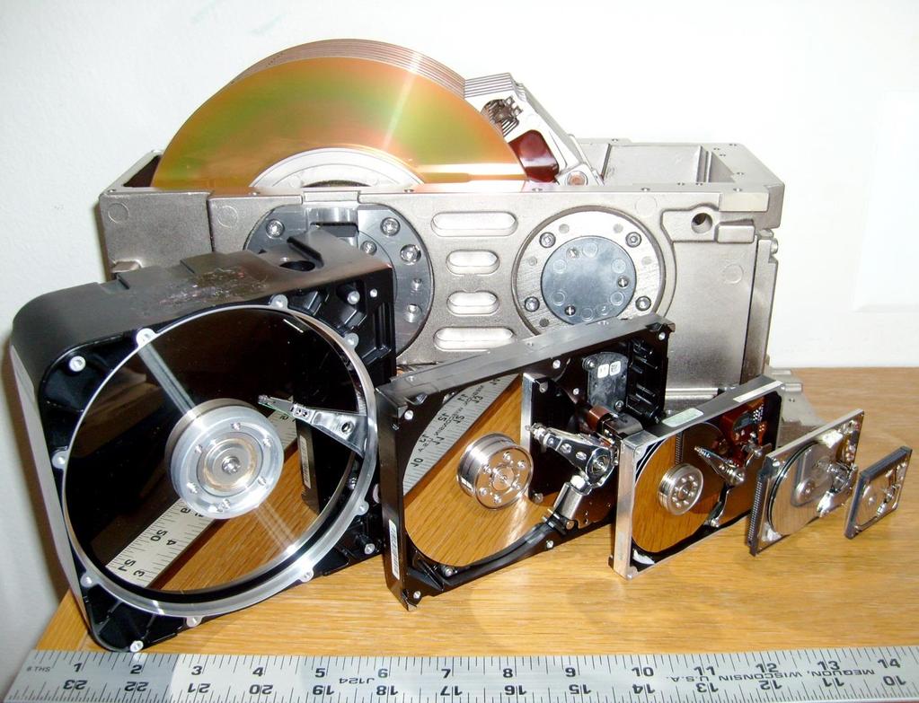Hard Drive Form Factors Six hard disk drives with cases opened showing platters