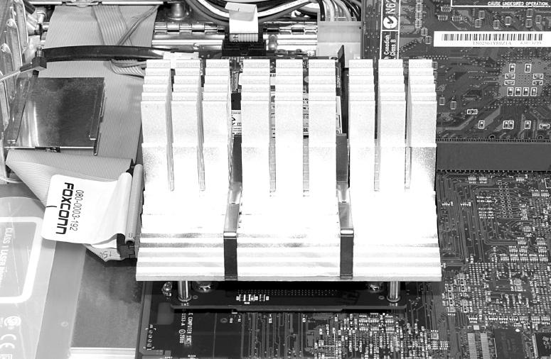 Installation AGP Graphics and Gigabit Ethernet Models 4. Align the s three holes with the three threaded posts on the logic board, then set the gently on top of the posts (Figure 12).
