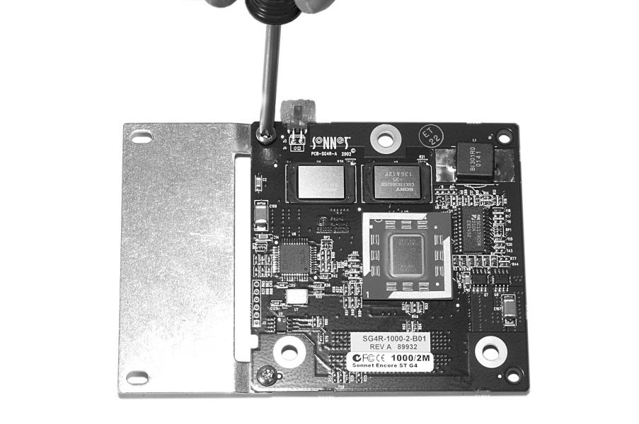With the Sonnet logo side of the board face up, place the Encore/ ST processor on top of the extension plate (support foot face down) as shown (Figure 28).