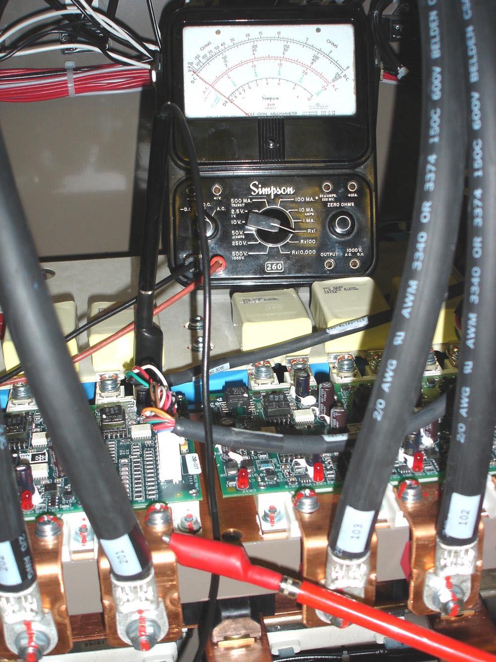 right hand terminal of the IGBT module. This is the positive bus connection. The analog meter reading will be near full scale to the left of the meter movement. The digital meter reading will be OL.