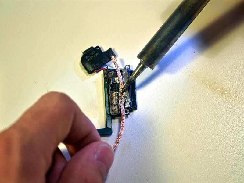To desolder the solder joint, place a copper desoldering braid on top of the existing solder and press down on the