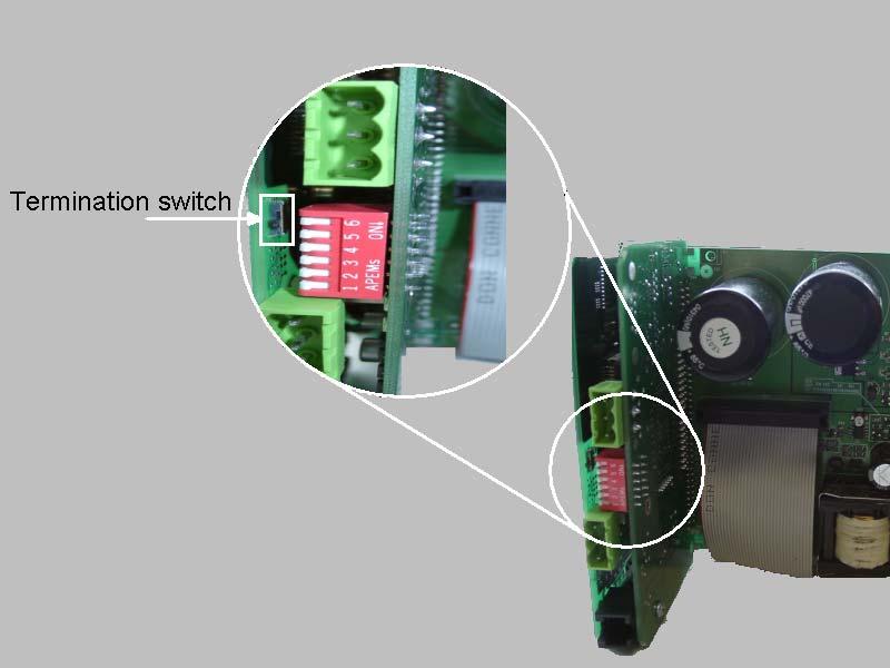 To access the switch, remove the six small screws from the rear of the module and gently remove the back plate. The switch is located above the MSC connection socket.