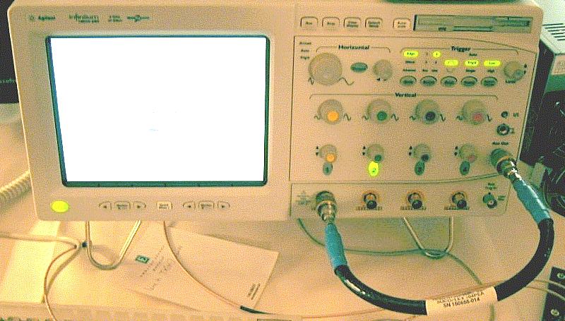 Calibrating the Digital Storage Oscilloscope A Precision SMA Adapter on Aux Out Precision SMA Adapter on Channel 1 Input Calibration Cable Figure 129 Calibration Cable Connection Example.