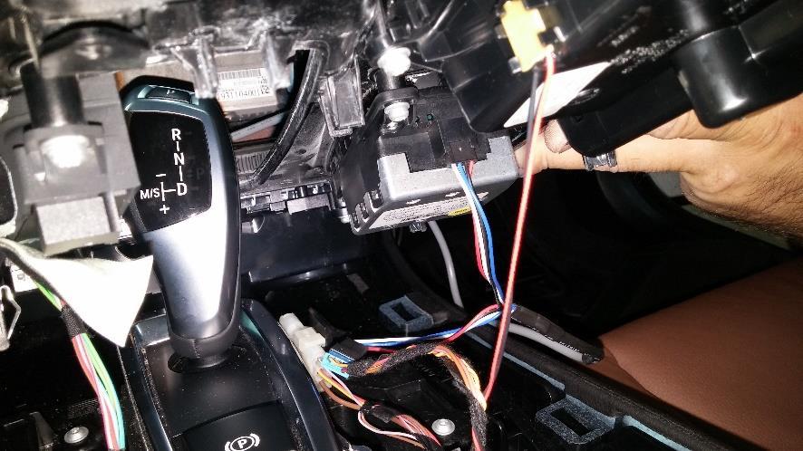 To access the idrive harness, remove the panel surrounding it (may