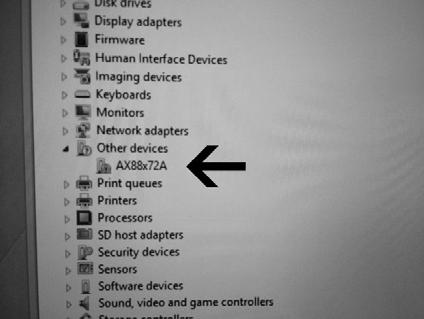 In the Device Manager window, find the device