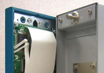 Figure 6. Installed Ferrite Clamp 6. Reattach the Front Panel 1. Connect the ribbon cable to the front panel.