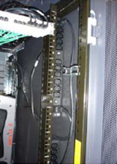 For the server cabinets, splice a Power Distribution Unit (PDU) power cable into each circuit with enough length to enter the cabinet in the front hole, shown in Figure 4, and reach the floor of