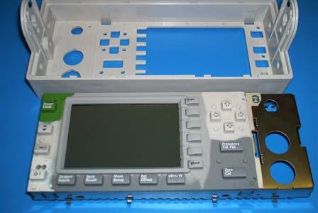 The Rubber Keypad is attached to the EMI Screen by 4 rubber mounting lugs.