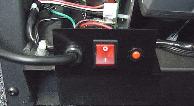 Depress the four clips on the on/off switch (two on the top and two on the bottom) and push the on/off switch out of the front of its mounting plate. Refer to Diagram 6.