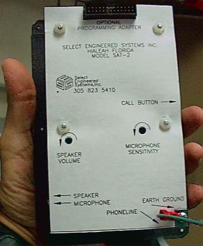 Re-Install the door and screw the 6 tamper resistant screws back in the front door. Press the call button. If the SAT3 has not been programmed, it will give a brief dial tone, and then hang up.