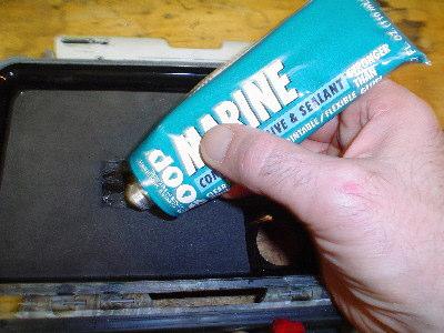 Using Marine GOOP place glue into each of the 3 holes as