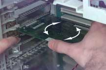 Remove any PCI cards (if installed) by spreading apart the retainer tabs and pulling the card out of the slot.
