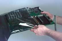 Remove the motherboard tray from the motherboard by lifting the two latches... Unlatch the motherboard tray.