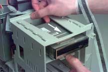 Unlatch the drive bay support to provide access to the floppy disk drive