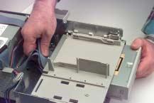 Once the hard drive is free, remove the SCSI and power cables from the hard drive.