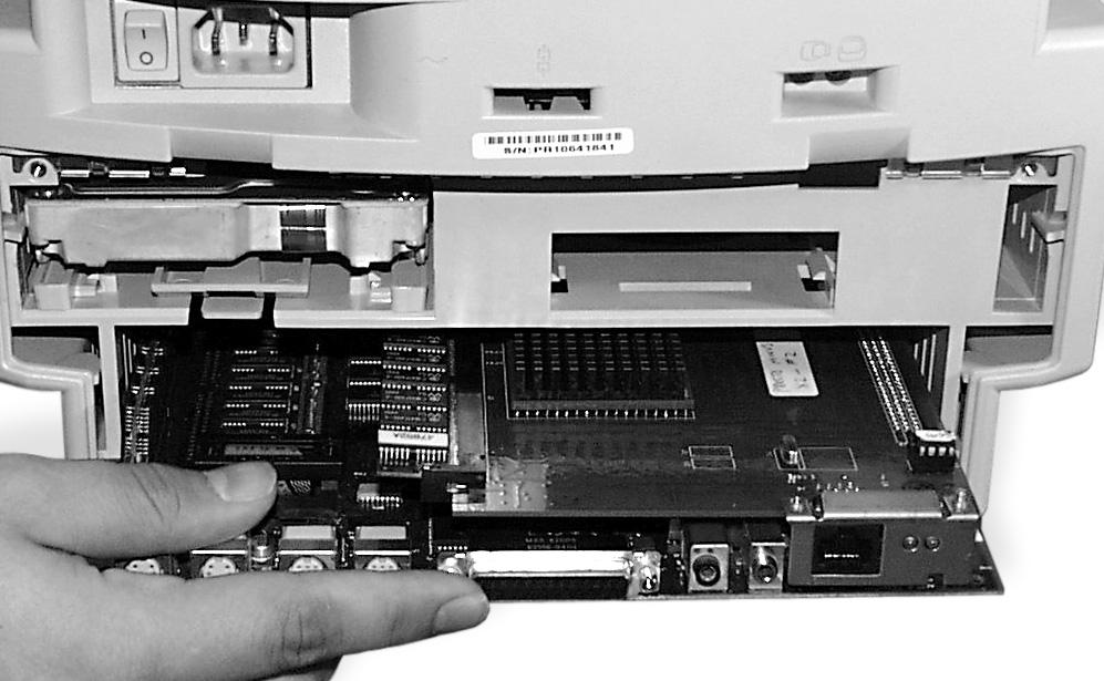 Slide the logic board into the computer (Figure 8) by first aligning it with the inner guides of the computer s case and then pushing it back until it fully in place.