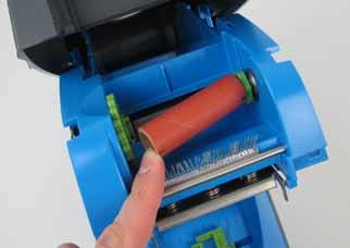 red-orange cardboard roll for the ink ribbon directly under the