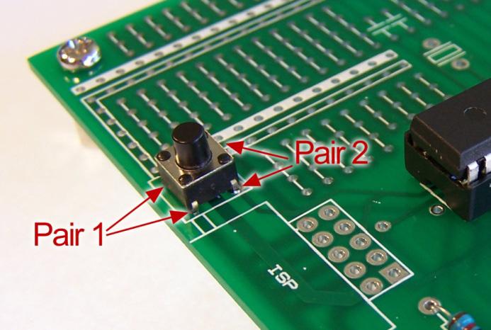 Figure 17. Pin pairs on micro tactile switch Using the continuity tester function on a multimeter, determine which pin corresponds to each pair and connect the switch to the board as per Figure 18.