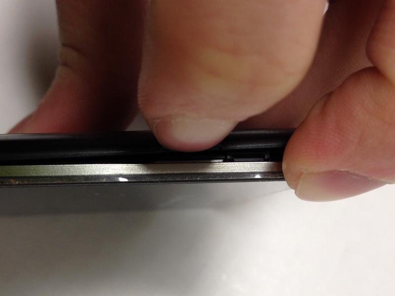 the gap located on the bottom-left side of the phone.