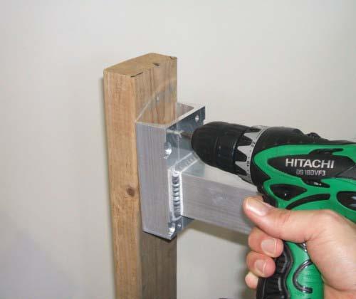 Figure 7: Attaching the Bracket to a Wall or Vertical Surface To attach the mounting bracket to a pole, place and hold the bracket in the